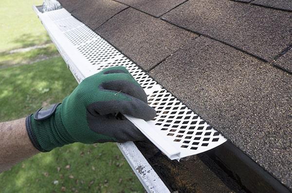 gutter guards can help reduce the risk of ice dams by improving water flow and reducing the chances of clogs