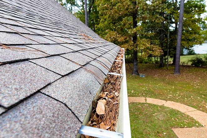 removing debris from home's gutters